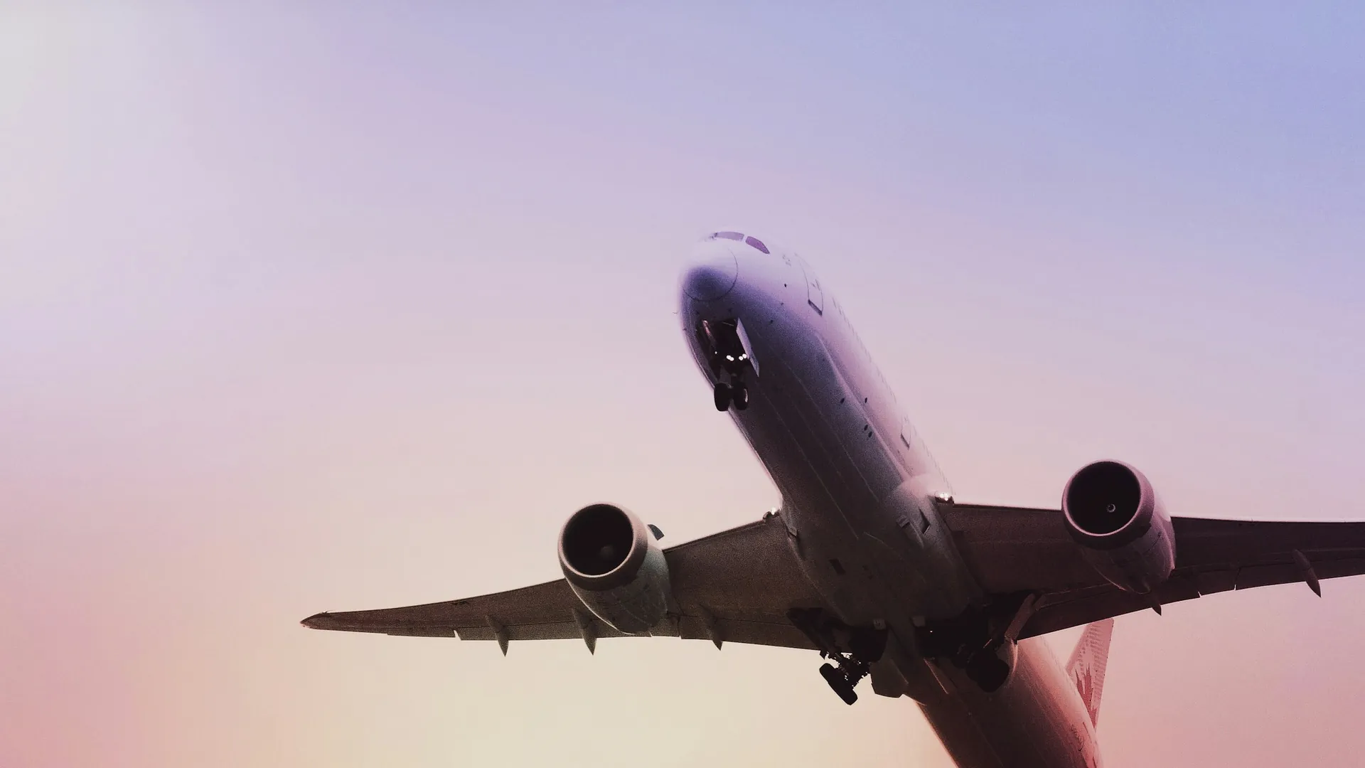 Aircraft climbing through the evening sky